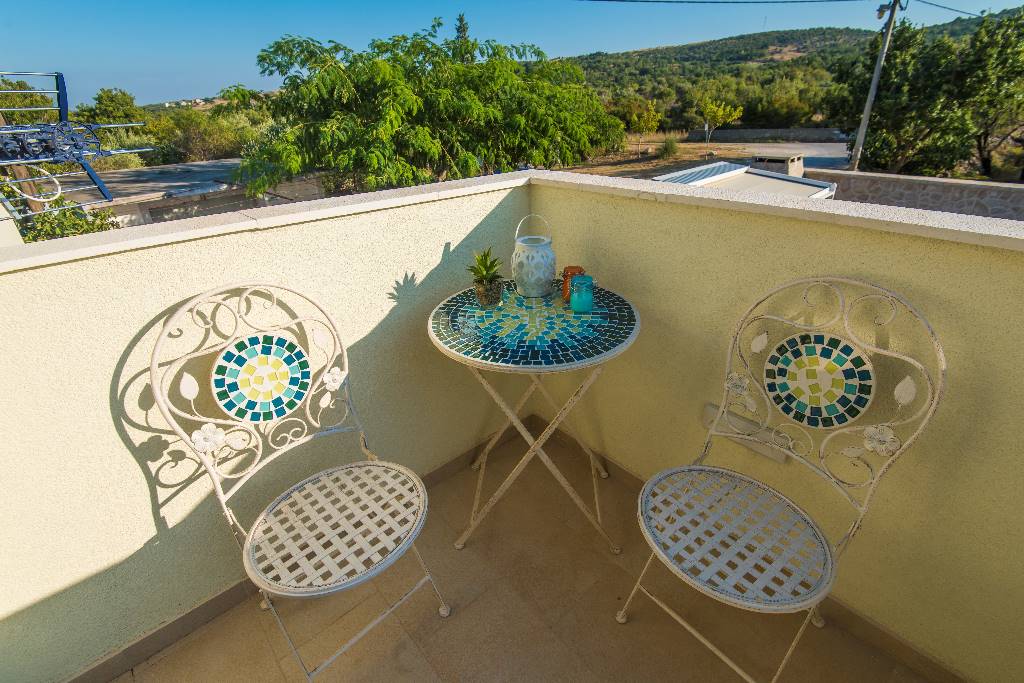 Terrace with a view of the swimmimg pool and countryside