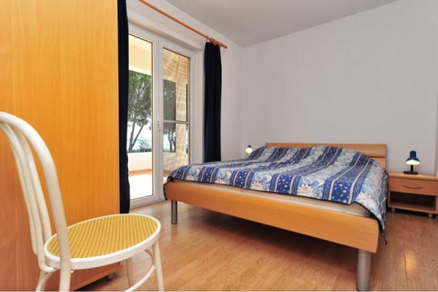 Schlafzimmer mit Terrasse und Meerblick